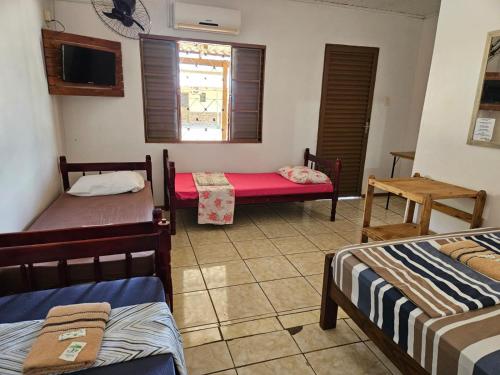 Ένα ή περισσότερα κρεβάτια σε δωμάτιο στο Hotel Alvorada