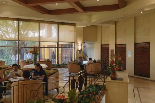 people sitting in the lobby of a hotel at Hotel Terranova in Coatzacoalcos