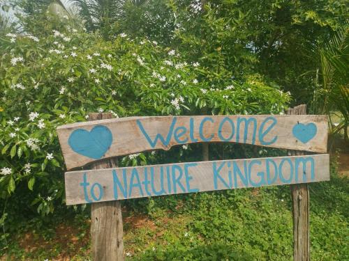a sign that says welcome to nature kingdom at Nature Kingdom Sri Lanka in Hambegamuwa