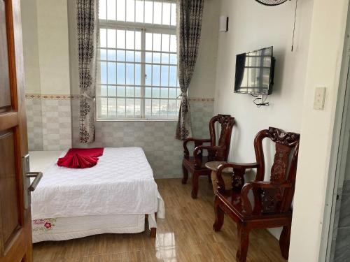 Ένα ή περισσότερα κρεβάτια σε δωμάτιο στο Hoang Linh Hotel