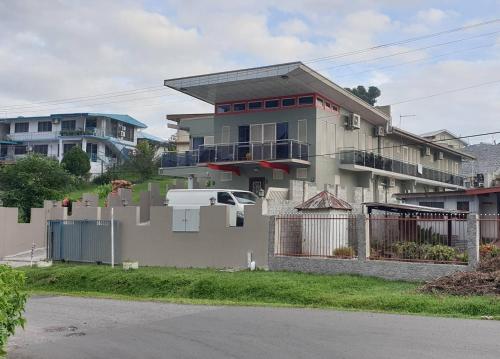 a house with a fence in front of it at 77 Fulaga Flats in Suva