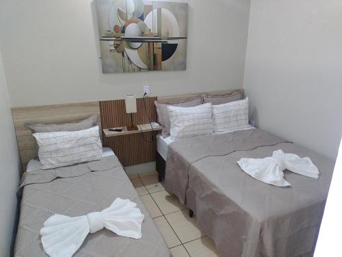 Ένα ή περισσότερα κρεβάτια σε δωμάτιο στο Hotel Glórias - Glórias 3