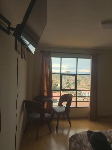 Гостиная зона в Acogedor Departamento con una hermosa vista a la Ciudad
