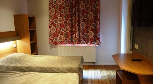 Letto o letti in una camera di Sleep Well Youth Hostel