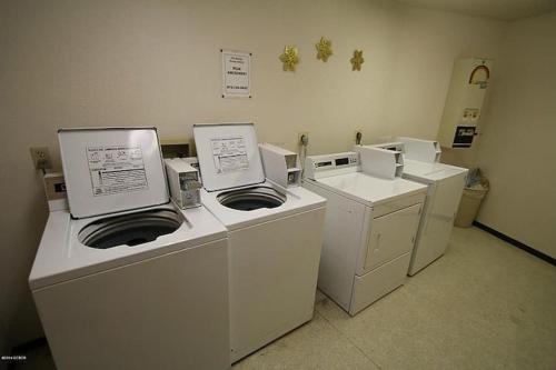 a laundry room with washers and dryers at Best Ski Condo, Winter Park, USA in Winter Park