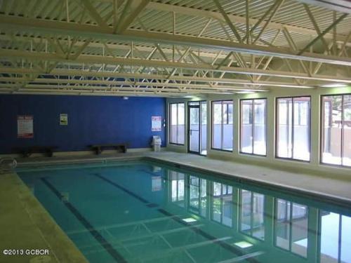 a large swimming pool in a large room at Best Ski Condo, Winter Park, USA in Winter Park