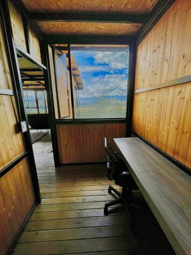 an inside view of a room with a window at Sans Souci Cabaña - Parejas in Guasca