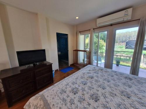 Postel nebo postele na pokoji v ubytování บ้านชยชิโต Chayachito Home Stay