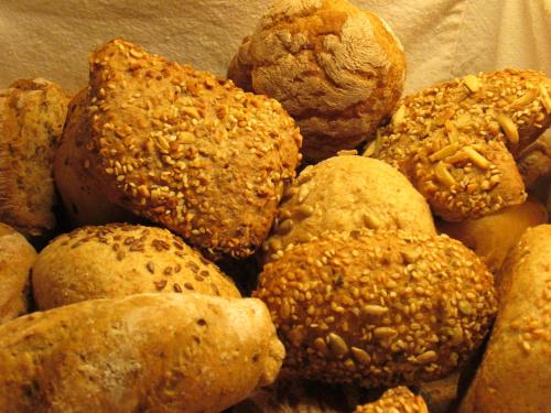 a pile of bagels sitting on top at Hotel Schönbrunn in Merano