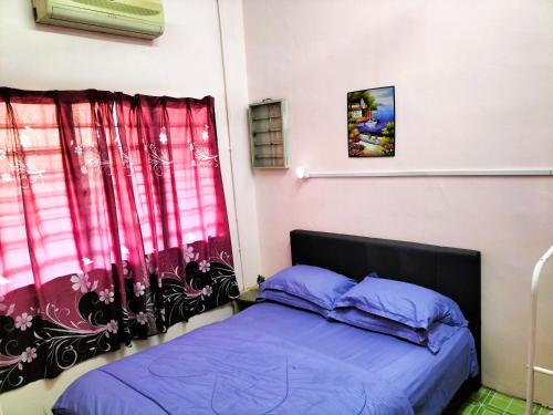 Postel nebo postele na pokoji v ubytování Homestay Pertama