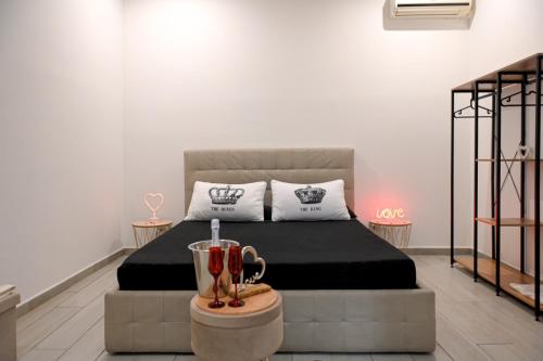 A bed or beds in a room at Momenti e wellness