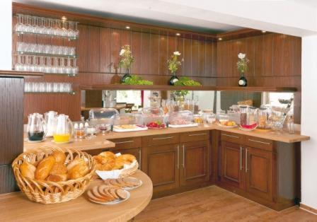 a kitchen with a counter with a table with bread at Wein-Träume in Thüngersheim