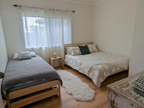 Ένα ή περισσότερα κρεβάτια σε δωμάτιο στο Cosy Brick Beachouse - ALL INCLUDED