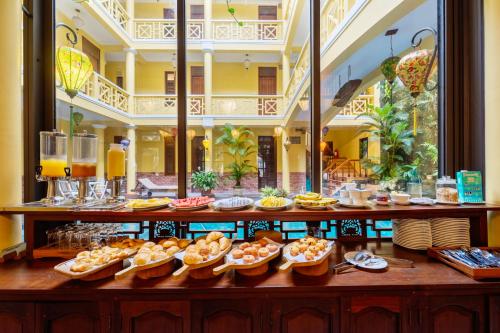 a buffet with many different types of food on display at Thanh Van 1 Hotel in Hoi An