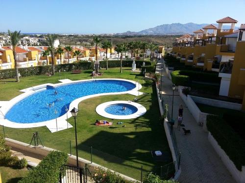 an overhead view of a swimming pool in a city at Salinas de Veras in Vera