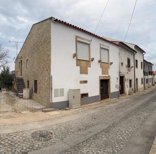 a white building on the side of a street at T2 Ansião in Ancião