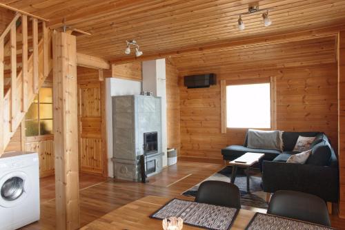 Et opholdsområde på Cottage with stunning lake view and private beach