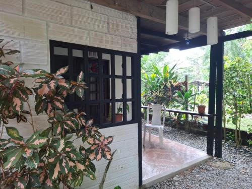 a building with a window and a chair in it at BlueBayou.capurgana in Capurganá