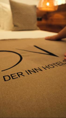 a sign on a bed with the word dear advisers on it at Der Inn Lara in Antalya