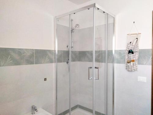 a shower with a glass door in a bathroom at Casa di Anna in Tolfa