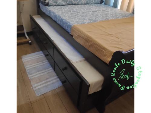 a bed frame with a drawers and a mattress at Paseo Verde Daily Staycation in Manila