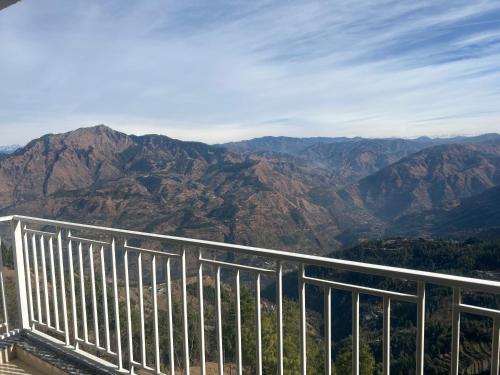 a view of the mountains from the top of a lookout at Perfecto stays in Mashobra