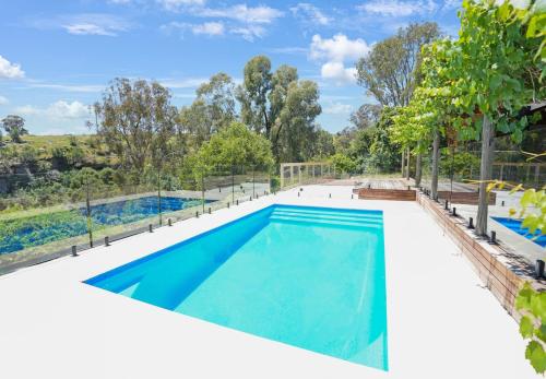 an image of a swimming pool in a house at Hil & Jack's Riverfront Cabin, Merrijig Mt Buller in Merrijig