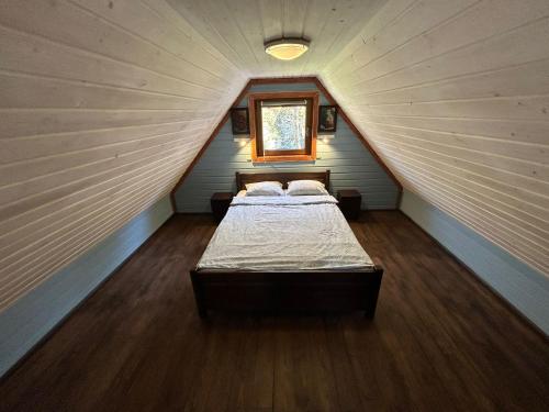 a room with two beds in a attic at Domek przy Rozpadlisku in Podgórzyn