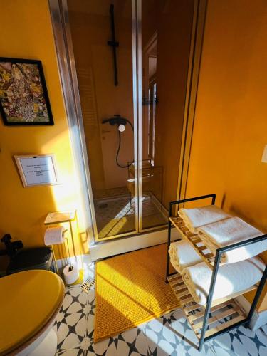a bathroom with a shower with a glass shower stall at Nina's winery forest house in Kiketi in Tbilisi City