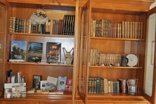a wooden book shelf filled with books at Villa L'Aurora in Pescara