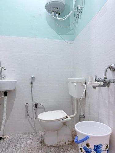 a bathroom with a shower and a toilet and a sink at Maa durga home stay in Faizābād