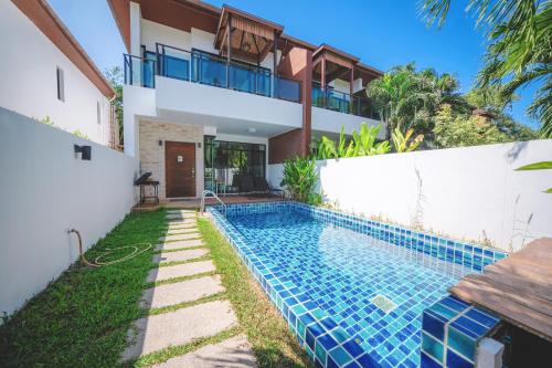 a swimming pool in the backyard of a house at Kamala Beach 3-bedroom villa near Fantasea with high-speed Wi-Fi and private pool in Kamala Beach