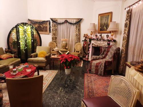 a living room filled with furniture and a fireplace at Cosy Villa in Pikérmion
