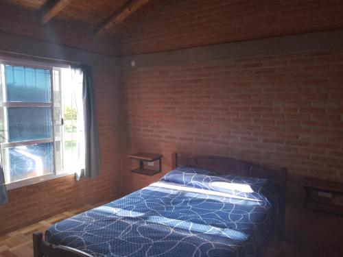 Postel nebo postele na pokoji v ubytování Cabaña las chinitas