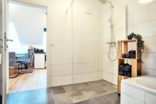 a bathroom with a shower and a sink at Ferienwohnung Muthenthaler, Wachau in Schwallenbach