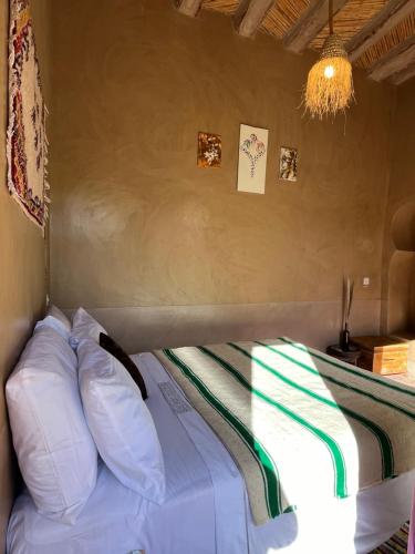 Postel nebo postele na pokoji v ubytování Heritage House Skoura