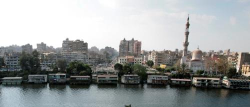 a view of a city with a river with houses at Hotel Flamenco Cairo in Cairo