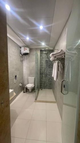 a bathroom with a shower and a toilet in it at Sky Star Hotel free shuttle to Hurghada City center in Hurghada