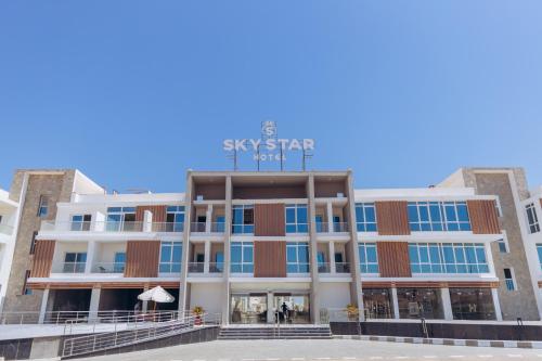 a building with a sign on top of it at Sky Star Hotel free shuttle to Hurghada City center in Hurghada