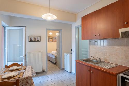 a kitchen with a sink and a counter top at City Center Appartment in Mytilini