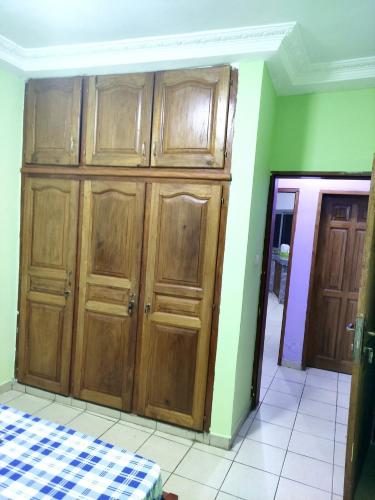 a large wooden cabinet in a room at YB-TECHs in Mbala
