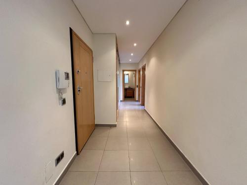 a corridor of an office building with a hallway at Quarteira Stylish 3 with Pool by Homing in Quarteira