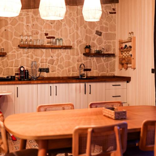 a kitchen with a table and chairs and a counter at Grand Paradise Resort Sapanca in Sapanca