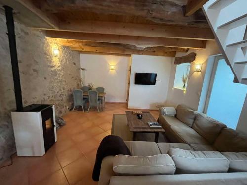 a living room with a couch and a table at No 10 Vic Fezensac in Vic-Fezensac