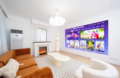 a living room with a couch and a large screen at Tonight Homestay West Nanjing Road Branch Shanghai in Shanghai