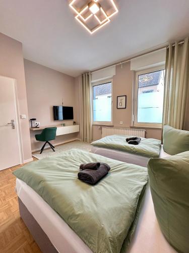 Кровать или кровати в номере Schulz Apartments Menden