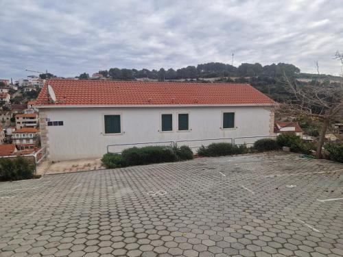 a large white house with a red roof at Solentia in Stomorska