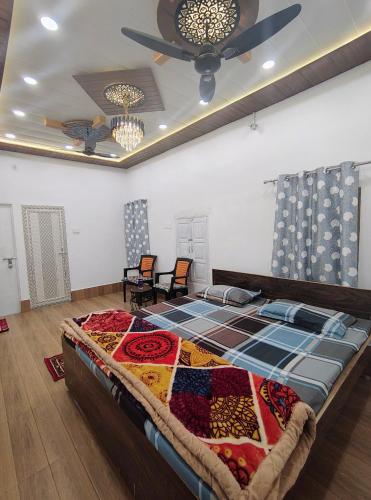 a large bed in a room with a ceiling at A ShivAngan Heritage Home Stay Near Ghat in Varanasi