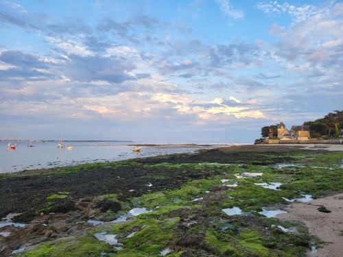 a large body of water with boats in it at maison proche plage du pouliguen baie de la baule in Le Pouliguen