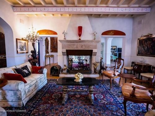a living room with a couch and a fireplace at Tenuta Del Gallo in Amelia